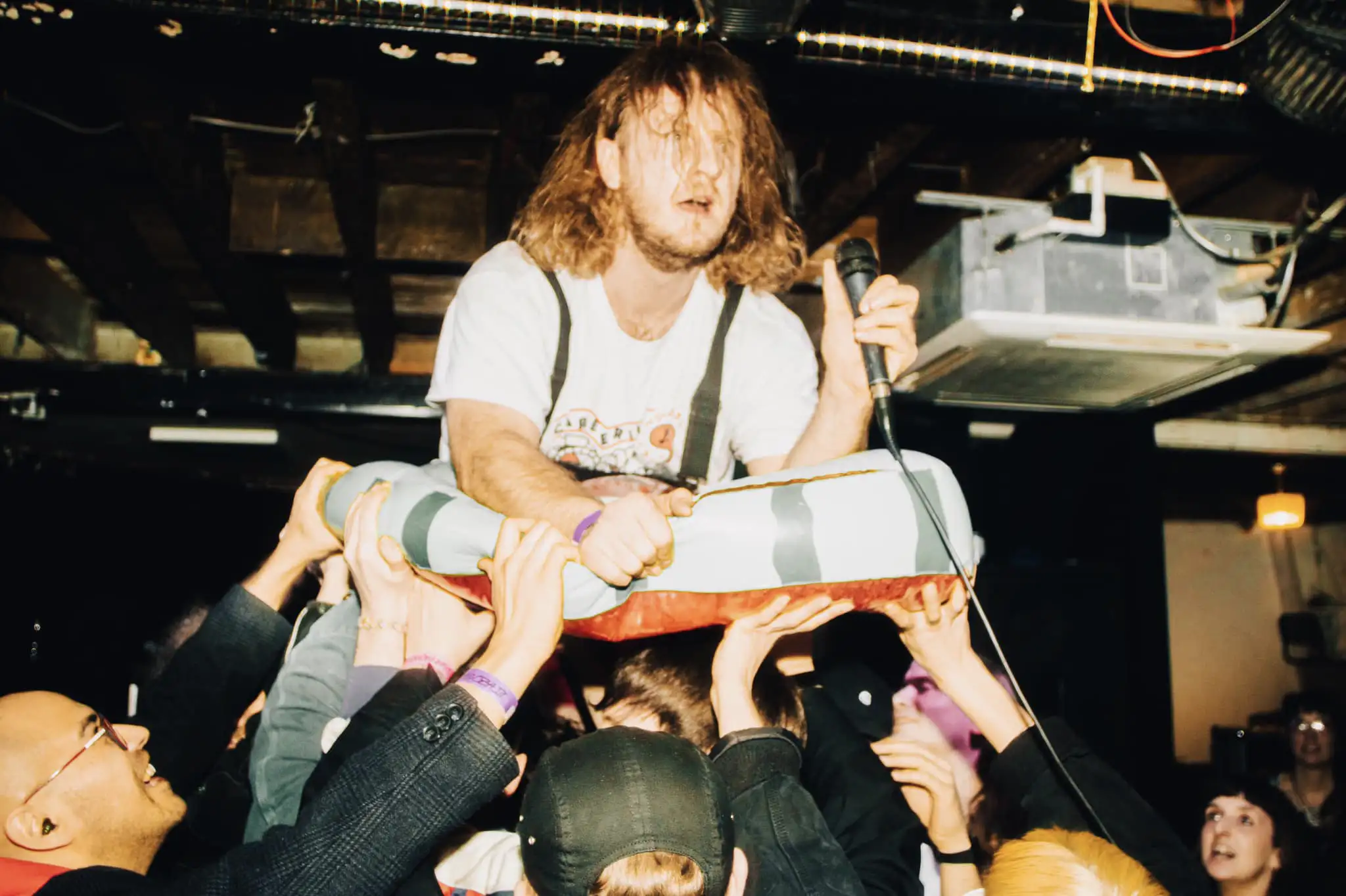 Crowd surfing at Society Of Losers event in Manchester