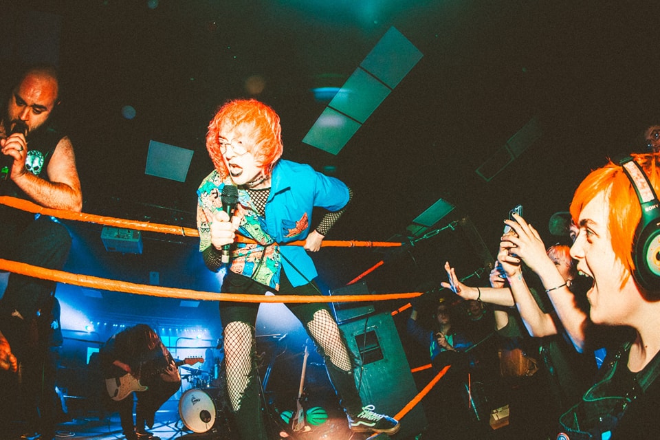 Lynskey in a wrestling ring